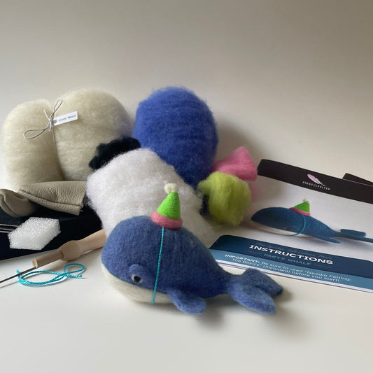 Felted animal toys with knitting needles and instructions on a white background