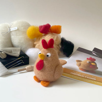 Plush toy chicken with tools and instructions on a white surface